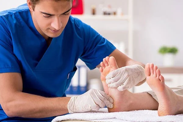 Podiatrist examining foot